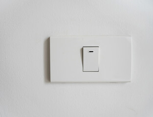 Minimal White Light Switch on Wall