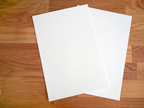 Blank Textured Paper Sheets on Wooden Table Background