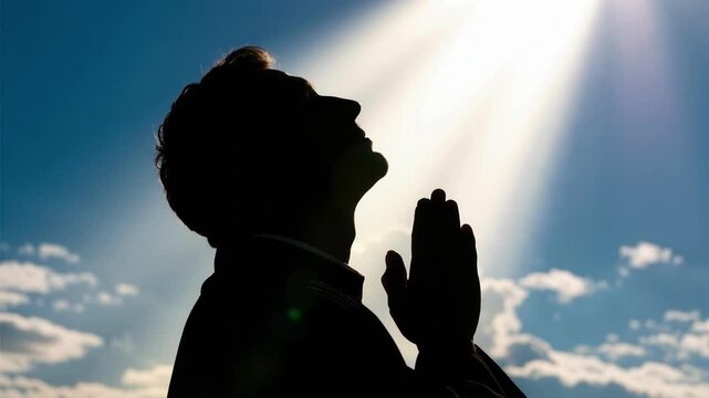 Cornelius in prayer with divine light shining down