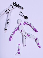 Disassembled Robot Toy Parts on White Background.
