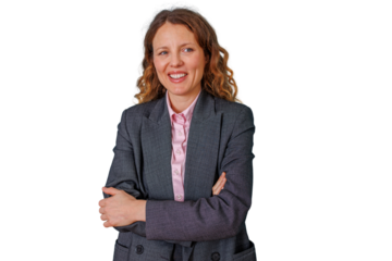 Cheerful female executive in a suit crossing arms, expressing confidence and professionalism, symbolizing business success. Transparent background