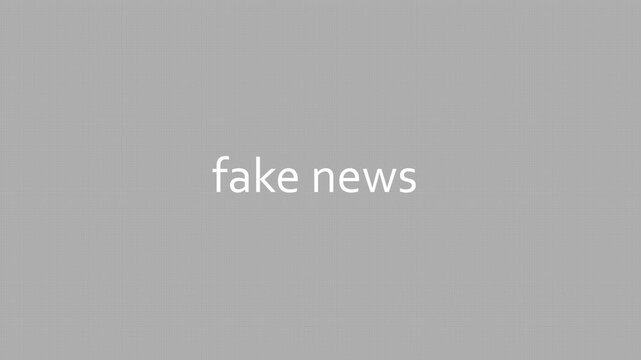 Words &ldquo;fake news&rdquo; being typed on a blank digital screen, representing misinformation, online deception, media distortion, and modern information risks. Motion graphics of fake news