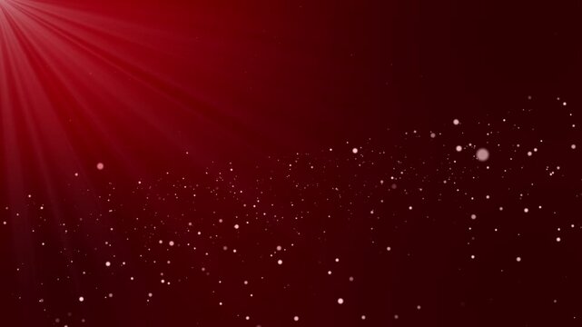 Abstract animated background with glowing silver particles floating in 3D space against a red color gradient background and animated light rays from the upper left corner creating cinematic motion
