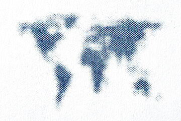 Blue halftone world map printed on paper macro texture