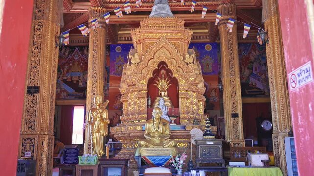 Ornate details of wat chalong buddhist temple exterior in Phuket, Thailand, showcasing traditional thai architecture.