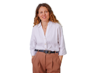 Confident mature woman smiling, having hands in pockets, posing for a portrait against a transparent background