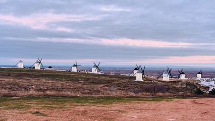 Campo de Criptana Windmills Castilla-La Mancha Spain at Dusk La Mancha Windmills on Hillside Under Cloudy Sky Travel Destination