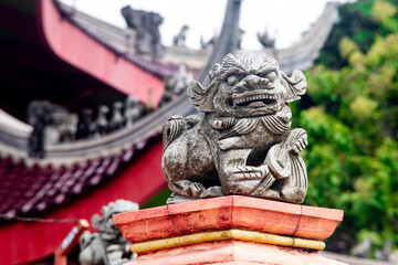 Stone Guardian Lion Sculpture in Traditional Asian Temple Architecture Representing Protection, Strength, and Spiritual Heritage