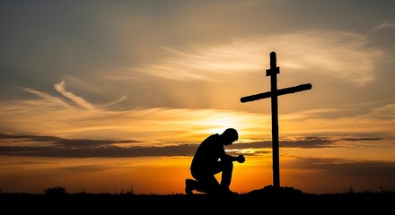 Person kneels before a cross at sunset, praying.