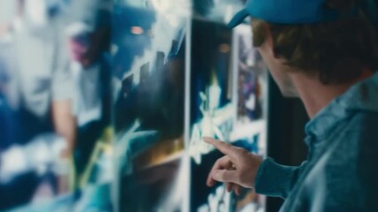 Medium shot of a person interacting with augmented reality overlay on printed advertisement showcasing dynamic digital content enhancing promotional visuals.