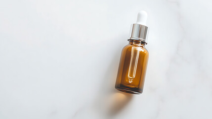 An amber bottle is placed on a white marble background. This image is suitable for a product advertisement or an aesthetic presentation in the beauty and cosmetics niche.