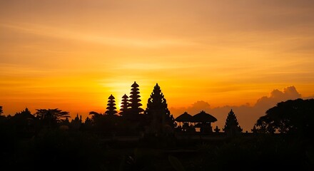 Sunset over silhouette trees landscape scene.