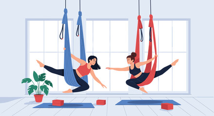Two women enjoying an aerial yoga class, gracefully stretching and balancing in colorful hammocks in a bright studio.