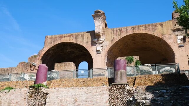 sunlit ancient roman brick arches richly patterned vaults appears alongside weathered purple porphyry columns layered stone terraces forum area surrounds scene view rome italy empire 
