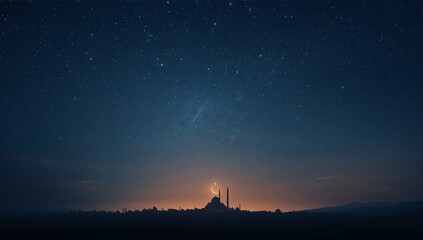 Silhouette of a grand mosque illuminated by a crescent moon under a vast, dark blue, star-filled night sky backdrop