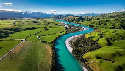 Obraz premium aerial view braided river farmland new zealand turquoise water green fields