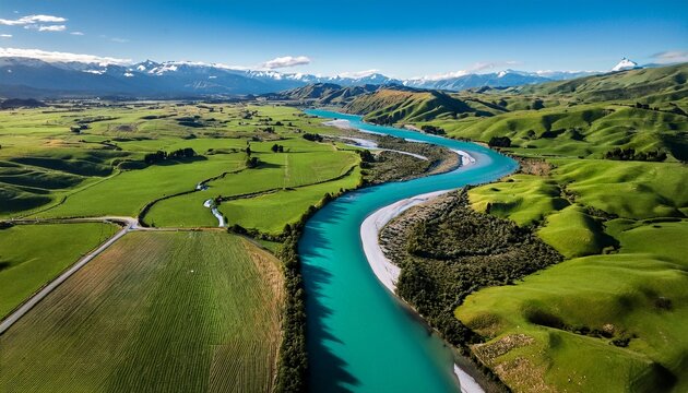 aerial view braided river farmland new zealand turquoise water green fields