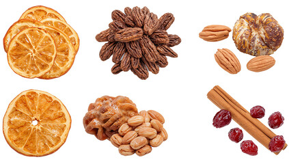 Collection of dried orange slices, pecans, almonds, cinnamon sticks and cranberries isolated on a black background