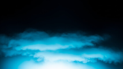 Dramatic blue clouds in dark night sky with bright light