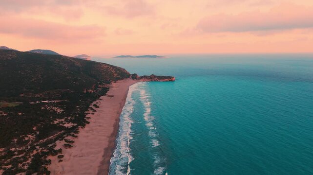 Patara Beach with its golden sand dunes stretch along crystal-clear turquoise water, one of the longest and most unspoiled beaches in Antalya, Turkey.