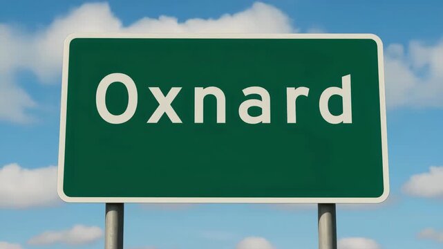 Oxnard city road sign with blue sky and clouds