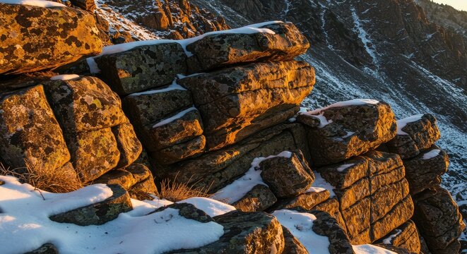 Rocky mountain face in winter sunlight