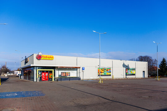 Zarow, Poland &ndash; December 26, 2025: Wide view of a Biedronka supermarket with parking area and surrounding infrastructure.