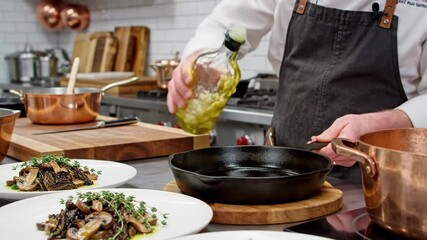 Chef pouring oil into a hot pan for cooking gourmet food.