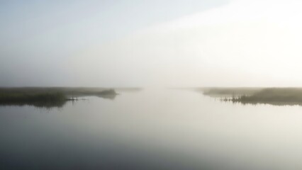 Serene morning mist over calm waters