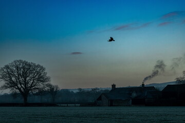 Smoke from chimney of the farmhouse in East Devon