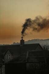 Smoke from chimney of the farmhouse in East Devon