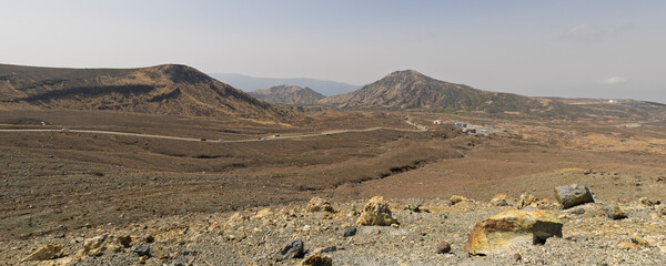 Panoramic view of of footwalk tot the crater of Mount Aso and Vulcano in Aso Kumamoto perfecture in Japan