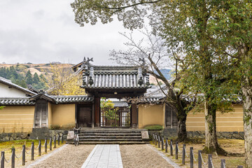 Entrance and surrounding wall of small temple in Todai-ji temple area in Nara, Honshu island in Japan