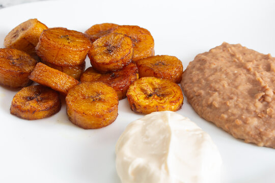 A closeup view of a plate of platano frita.