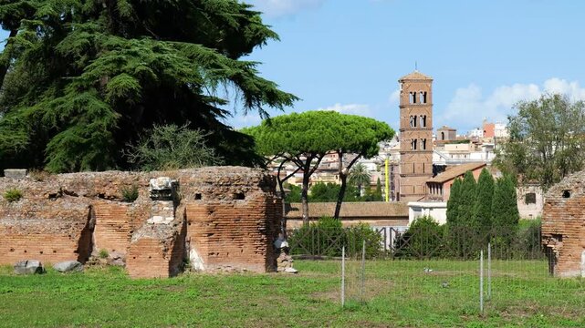 ancient roman brick ruins foreground frame umbrella pines medieval bell tower classic cityscape appears house augustus rome italy empire emperor of historical architecture 