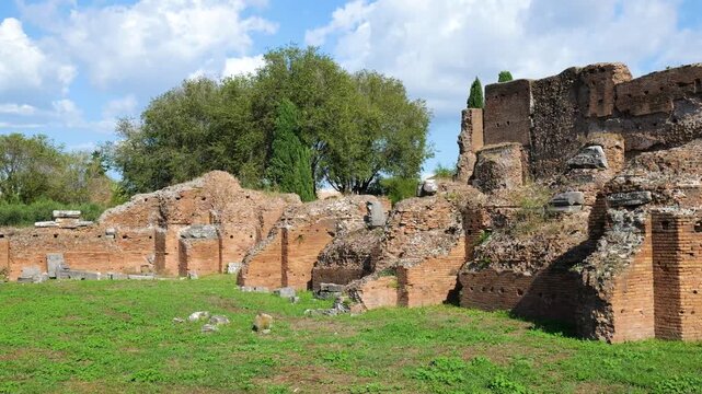 stretch ancient roman brick walls tiered ruins appears marble fragments greenery leafy trees shade house augustus long rome italy empire emperor of 