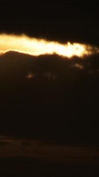Clouds at cloudy sunset. Time Lapse. 4K Vertical