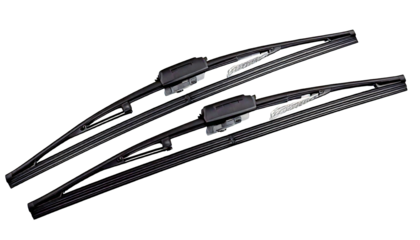 Two dark grey car windshield wiper blades, with angled diagonally on a, isolated on a transp 