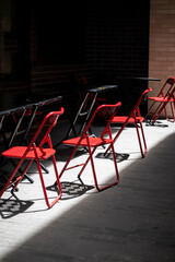 Four red chairs, Sydney in a street cafe, NSW, Australia