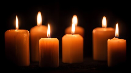 Glowing Candles in Darkness - A Serene and Warm Ambiance of Light and Shadows.