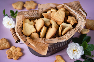 Homemade cookies in a metal basket. Sweet cookies for breakfast. Close-up