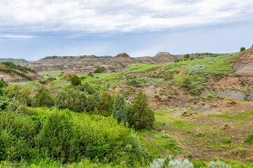 A view from a hilltop overlooking a beautiful landscape in the Theodore Roosevelt National Park in North Dakota