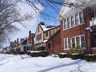 Residential street with row of houses in winter