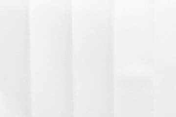 Minimalist white paper texture with vertical lines for background or wallpaper design.