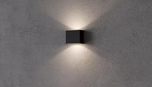 Modern black wall sconce casting soft light on textured gray wall