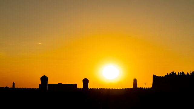 South Gate and wall (Tosh Darvosa) at sunset, Ichan Kala Old City, Khiva, Kizilkum desert, Khwarezm region, Uzbekistan