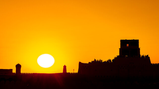South Gate and wall (Tosh Darvosa) at sunset, Ichan Kala Old City, Khiva, Kizilkum desert, Khwarezm region, Uzbekistan