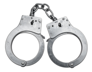 A pair of shiny, silver metallic restraints, linked by a chain. Isolated on a black background