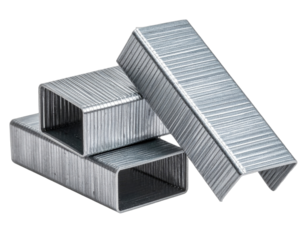 Close-up of four metallic staples, showing details, light reflections, and layered positioning