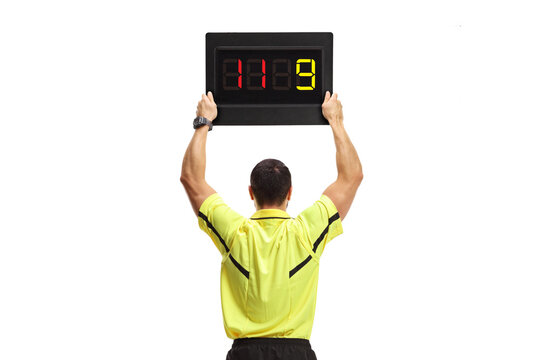 Rear view shot of a football referee with a substitute board